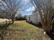Spacious backyard featuring a storage shed and mature trees at 6361 Boxwood St, Brooksville, FL 34602
