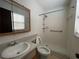 Bathroom with a walk-in shower, white fixtures, and a neutral color scheme at 6361 Boxwood St, Brooksville, FL 34602
