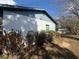 Side view of the exterior of home with landscaping and side window at 6361 Boxwood St, Brooksville, FL 34602