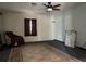 Spacious living room featuring ceiling fan, carpet, and traditional rug at 6361 Boxwood St, Brooksville, FL 34602