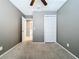Bedroom with view to bathroom, closet, carpet and neutral walls at 6402 S Cameron Ave, Tampa, FL 33616