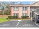 Charming two-story condo with brick accents, manicured landscaping, and convenient guest parking spaces at 6440 Spring Flower Dr # 11, New Port Richey, FL 34653
