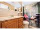 Cozy bathroom featuring a wood vanity, decorative shower curtain, and a tiled countertop, creating a functional space at 6710 Devonshire Ln # 10A, New Port Richey, FL 34653
