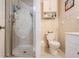 Bathroom with walk-in shower, vanity, and patterned tile backsplash at 6710 Devonshire Ln # 10A, New Port Richey, FL 34653