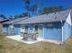 A backyard patio with a table and chairs, perfect for outdoor dining and entertaining at 7125 Silverwood Dr, New Port Richey, FL 34654