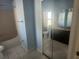 Bathroom with a vanity, mirror, lighting, and a shower at 7125 Silverwood Dr, New Port Richey, FL 34654