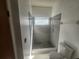 Modern bathroom with a tile shower, mosaic floor, and a sleek shower fixture at 7125 Silverwood Dr, New Port Richey, FL 34654