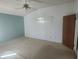 Bright bedroom featuring a ceiling fan, neutral carpet, and natural light through the windows at 7125 Silverwood Dr, New Port Richey, FL 34654