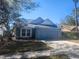 Charming single-story home with a two-car garage and well-maintained lawn in a quiet neighborhood at 7125 Silverwood Dr, New Port Richey, FL 34654