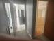 Hallway with an opening to a full bathroom and a living area at 7125 Silverwood Dr, New Port Richey, FL 34654