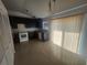 Bright kitchen featuring dark cabinets, tile floors, and modern appliances at 7125 Silverwood Dr, New Port Richey, FL 34654