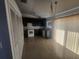 Clean kitchen with dark cabinets, white appliances, and tile floors at 7125 Silverwood Dr, New Port Richey, FL 34654