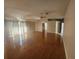 Bright living room boasting hardwood floors, neutral walls, and sliding glass doors to let in plenty of light at 7125 Silverwood Dr, New Port Richey, FL 34654