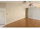 Spacious living room with hardwood floors, ceiling fan, and neutral wall paint at 7125 Silverwood Dr, New Port Richey, FL 34654