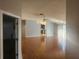 Open living room featuring hardwood floors and a ceiling fan for added comfort at 7125 Silverwood Dr, New Port Richey, FL 34654
