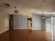 Spacious living room with hardwood floors, an open floor plan, and plenty of natural light at 7125 Silverwood Dr, New Port Richey, FL 34654
