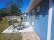 Outdoor patio space with seating, perfect for entertaining or enjoying the beautiful backyard at 7125 Silverwood Dr, New Port Richey, FL 34654