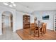 Bright dining room featuring a wood table with seating for six and a decorative hutch at 7205 Pinehurst Dr, Spring Hill, FL 34606