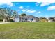 Well-manicured front yard and charming single-story home offer great curb appeal at 7205 Pinehurst Dr, Spring Hill, FL 34606
