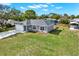 Charming single-story home with a large front yard and driveway at 7205 Pinehurst Dr, Spring Hill, FL 34606