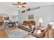 Inviting living room features a fireplace, ceiling fan, and neutral wall color scheme at 7205 Pinehurst Dr, Spring Hill, FL 34606