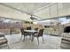 Relax on the covered patio with ceiling fan and views of the backyard at 7205 Pinehurst Dr, Spring Hill, FL 34606