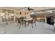 Enjoy a meal on the covered patio with ceiling fan and spacious seating area at 7205 Pinehurst Dr, Spring Hill, FL 34606