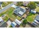 Aerial view of home with a fenced backyard, shed, and screened-in patio, providing a private outdoor space at 7205 Pinehurst Dr, Spring Hill, FL 34606