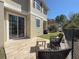 Backyard featuring a paved patio with outdoor seating, perfect for relaxing and entertaining at 7624 Red Mill Cir, New Port Richey, FL 34653