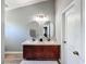 Bathroom featuring a double vanity with granite countertop, creating a modern and functional space at 7624 Red Mill Cir, New Port Richey, FL 34653