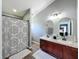 Bright bathroom with double sinks, shower, and tub combo; perfect for comfortable Gathering living at 7624 Red Mill Cir, New Port Richey, FL 34653