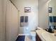 Bathroom with shower and tub combination, featuring tile floors and neutral colors at 7624 Red Mill Cir, New Port Richey, FL 34653