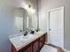 Bathroom features dual sinks, granite countertop, and modern fixtures at 7624 Red Mill Cir, New Port Richey, FL 34653