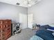 Bedroom with carpet, tall ceilings, and white ceiling fan at 7624 Red Mill Cir, New Port Richey, FL 34653