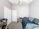 Bedroom with carpet, a ceiling fan and closet at 7624 Red Mill Cir, New Port Richey, FL 34653