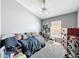 Bedroom with a large bed, carpet, natural light and desk at 7624 Red Mill Cir, New Port Richey, FL 34653