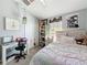 Bedroom with cozy bed, bright window light, and custom decor at 7624 Red Mill Cir, New Port Richey, FL 34653