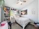 Cozy bedroom with decorated walls, ceiling fan and carpet at 7624 Red Mill Cir, New Port Richey, FL 34653