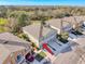 Aerial view of townhome showing garage, balconies, and the overall layout in a neighborhood setting at 7624 Red Mill Cir, New Port Richey, FL 34653
