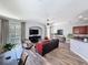 Cozy living room with ample natural light, a ceiling fan, and stylish furnishings at 7624 Red Mill Cir, New Port Richey, FL 34653