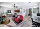 Open-concept living room featuring kitchen and dining area views, with stylish decor and ample space at 7624 Red Mill Cir, New Port Richey, FL 34653