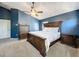 Elegant bedroom with dark wood furniture and ample space, creating a luxurious private retreat at 7624 Red Mill Cir, New Port Richey, FL 34653