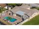 Aerial view of a fenced backyard featuring a private pool and patio area at 7901 Willow Brook Ct, Hudson, FL 34667