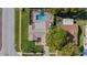 Aerial view of a home with a private backyard pool and patio area at 7901 Willow Brook Ct, Hudson, FL 34667