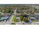 Wide aerial view showcasing a neighborhood with mature trees and well-maintained homes at 7901 Willow Brook Ct, Hudson, FL 34667