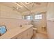 Bathroom featuring a shower, sink, and toilet at 7901 Willow Brook Ct, Hudson, FL 34667
