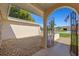 View of the property showcasing a decorative iron gate leading to the front door at 7901 Willow Brook Ct, Hudson, FL 34667