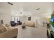 Expansive living room with tile floors, multiple ceiling fans, and plenty of natural light at 7901 Willow Brook Ct, Hudson, FL 34667