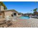 Outdoor entertaining on a large brick patio, complete with a dining set and pool at 7901 Willow Brook Ct, Hudson, FL 34667