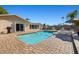 Beautiful pool and patio with clear blue water, complemented by palm trees and comfortable lounge chairs at 7901 Willow Brook Ct, Hudson, FL 34667